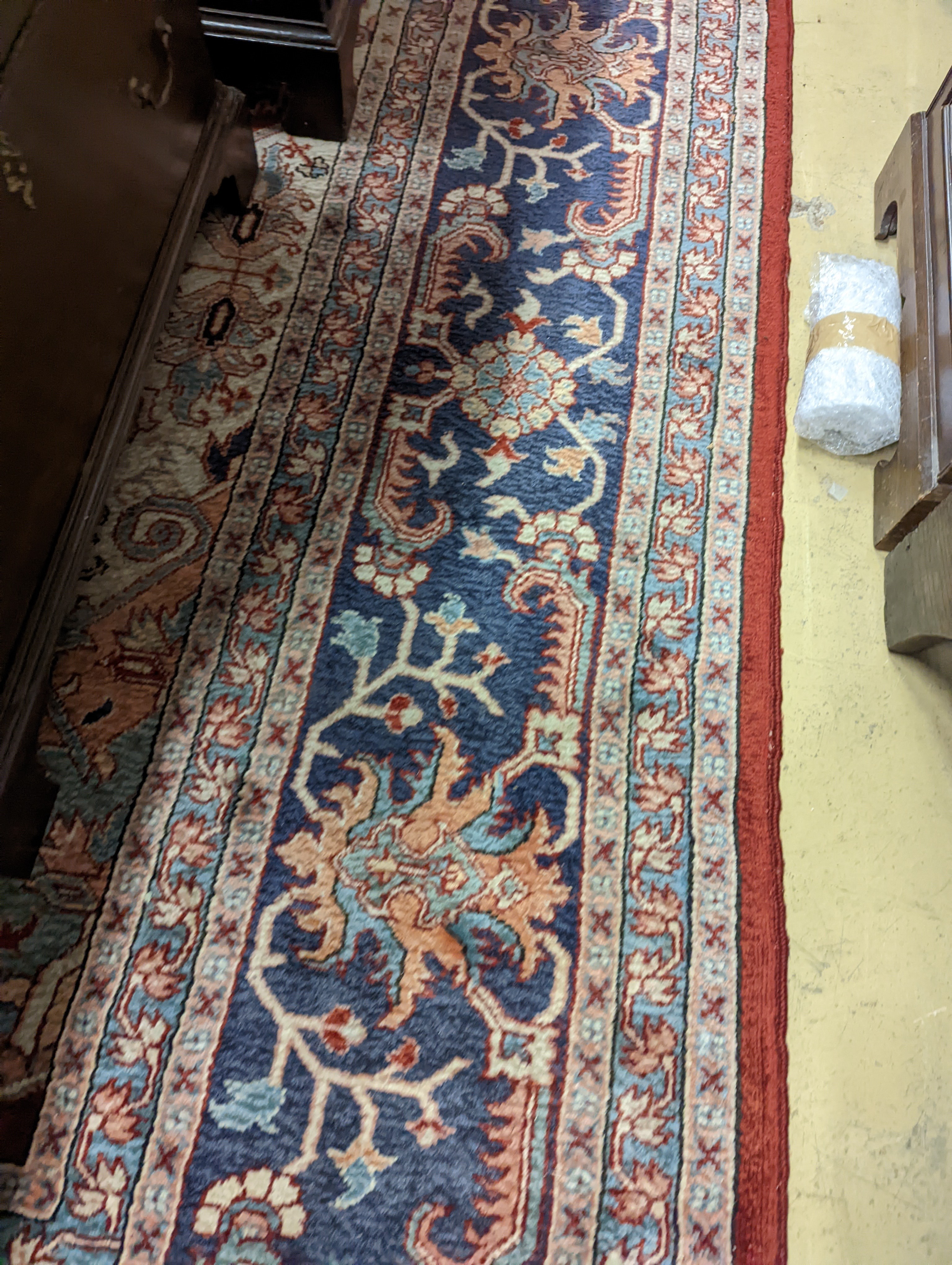 A large Caucasian style red ground carpet, 460 x 330cm